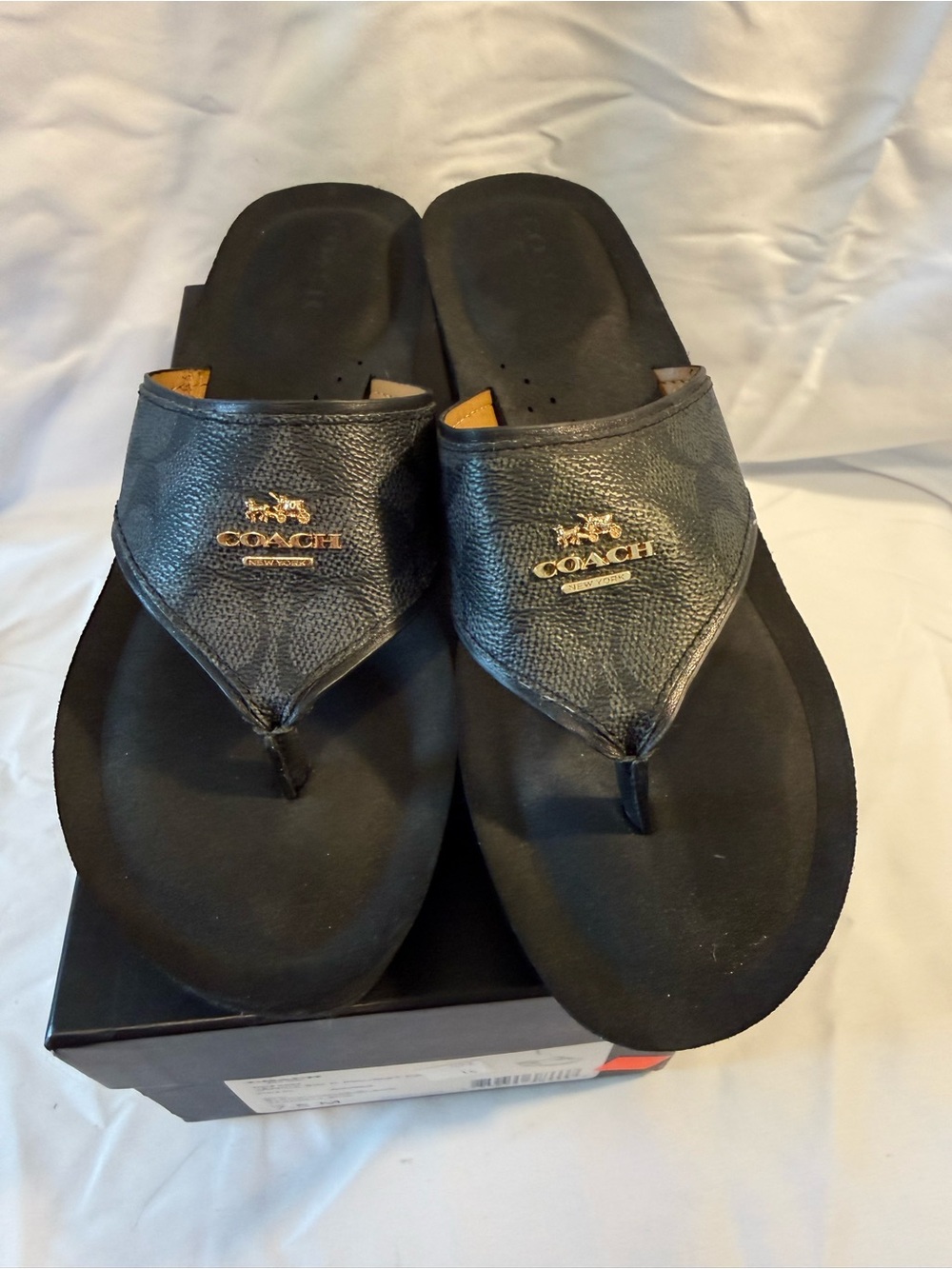 Coach Women's Black Leather Logo Thong Sandals with Gold Accent